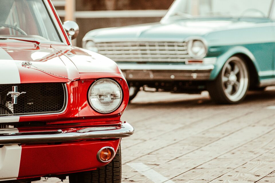 A row of vehicles lined up on a dealer lot