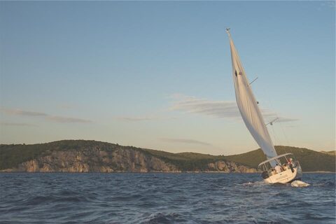 A sailboat heeling in the breeze
