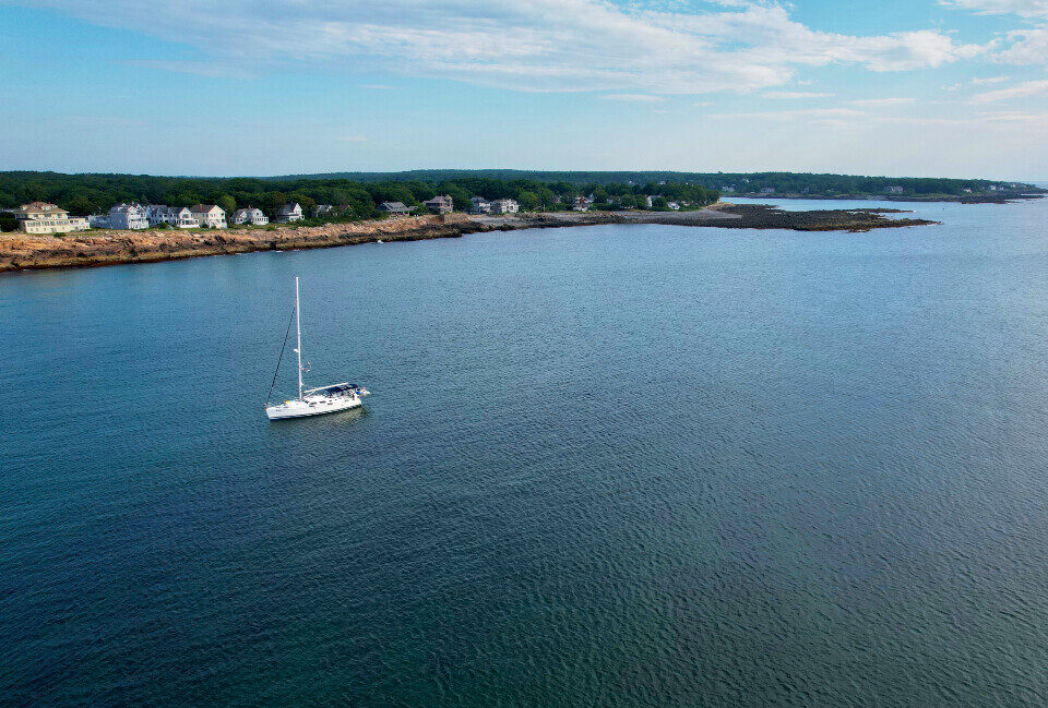 A sailboat on a calm blue bay