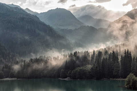 A valley lake mirroring the clouds