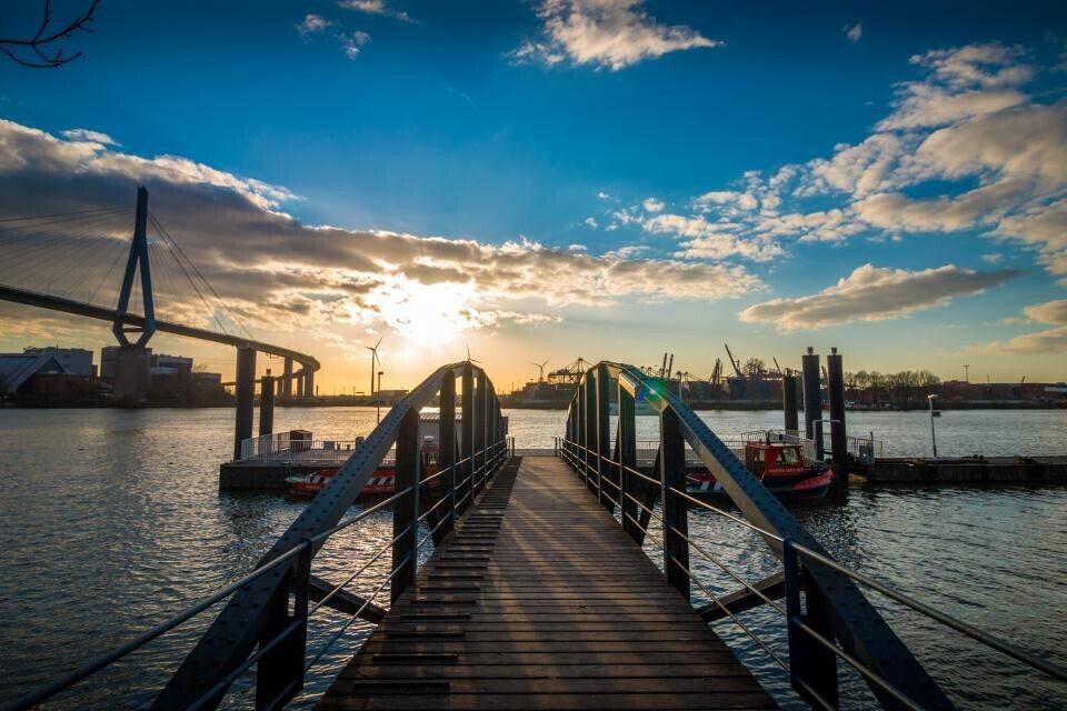 A wooden pier at sunset