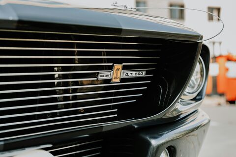The chrome grille of a classic car up close