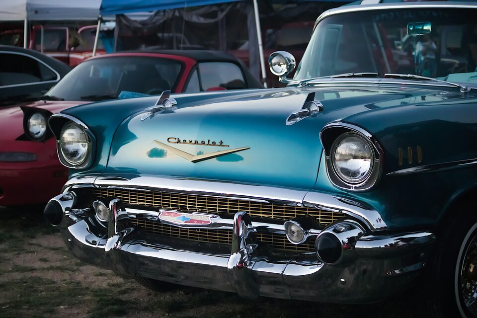 A teal classic Chevrolet Bel Air at a car show