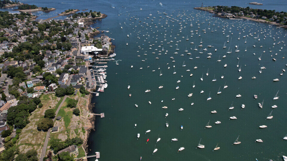 Boats scattered across a harbor seen from above