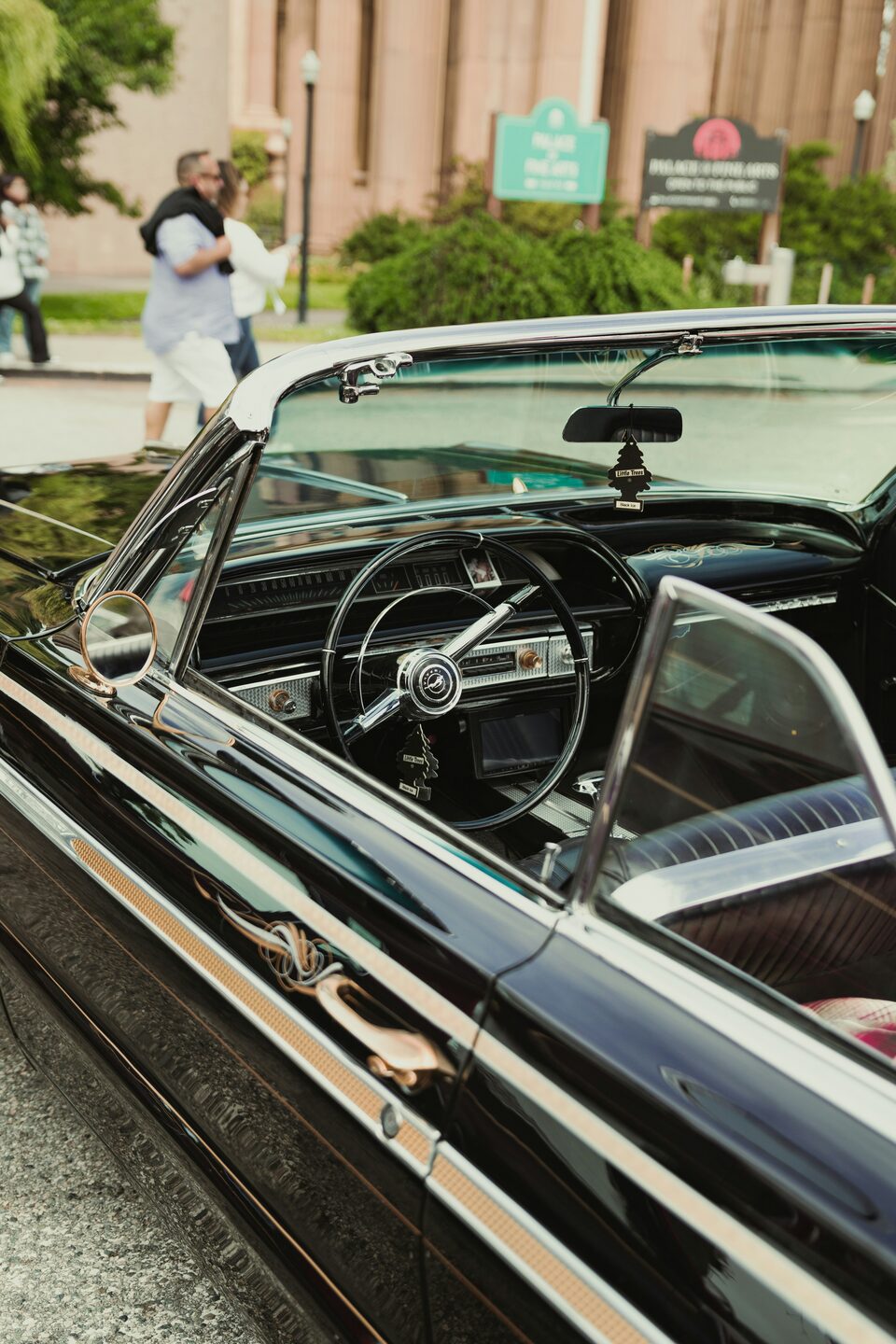 The steering wheel and dash of a classic convertible