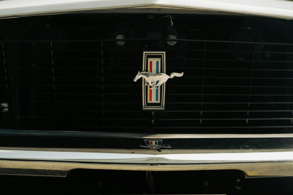 The running horse emblem on a Ford Mustang grille