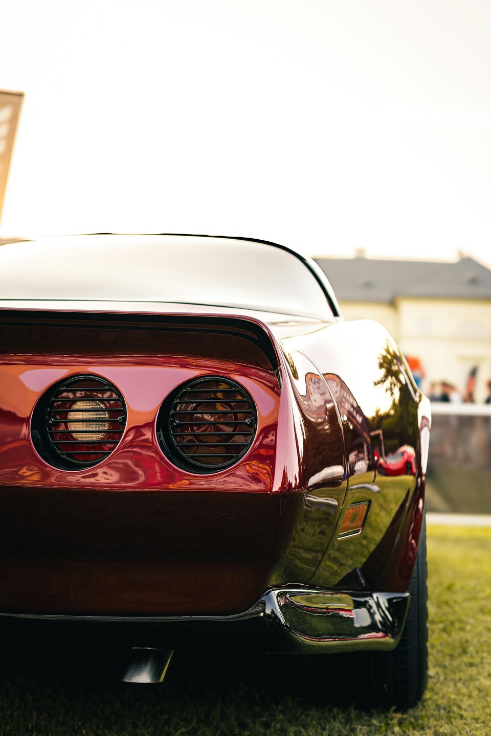 The round taillights of a red classic Corvette