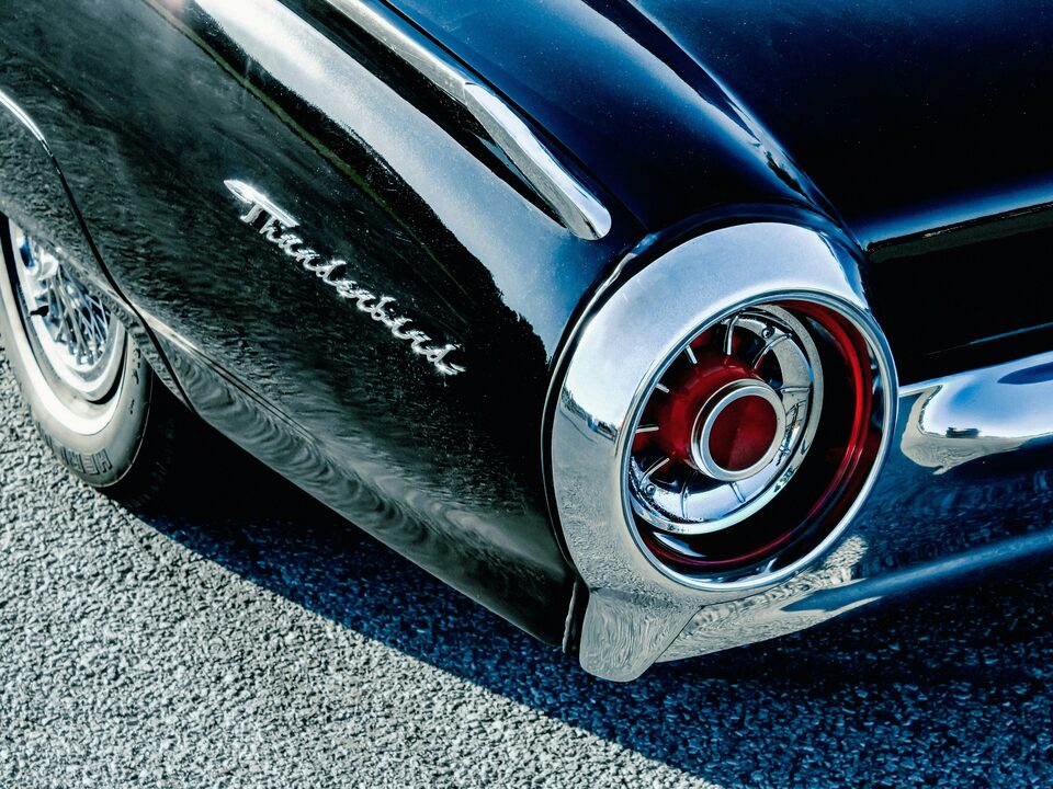 The chrome taillight of a classic Ford Thunderbird