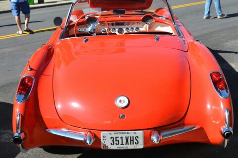 The rear of a red classic Corvette convertible