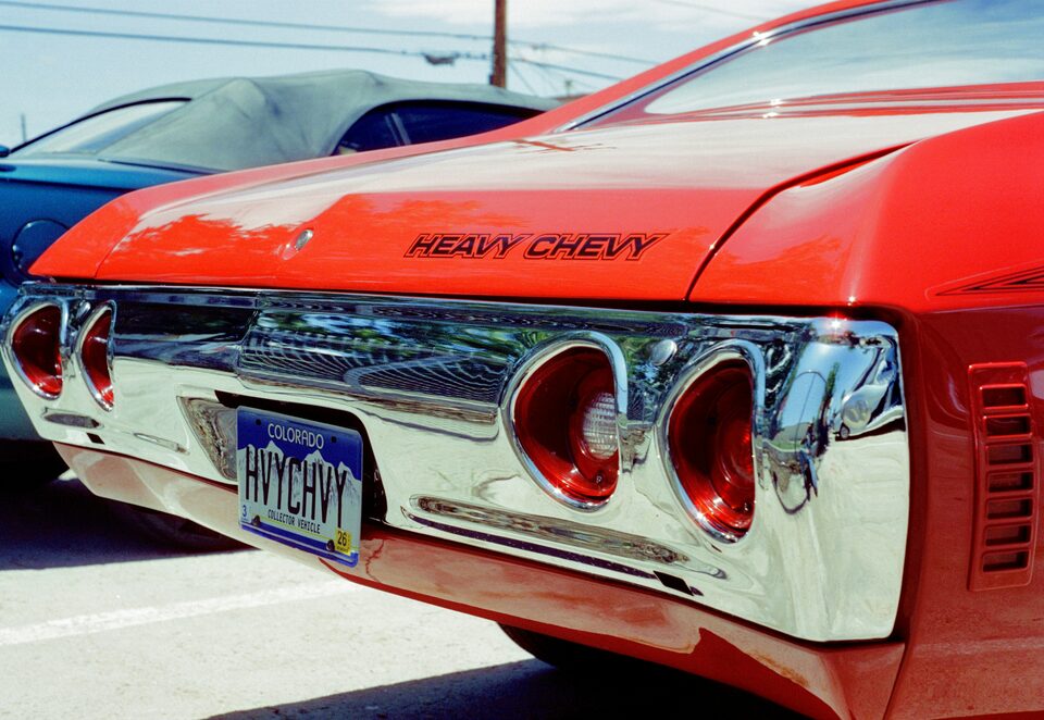 The taillights of a red classic Chevrolet