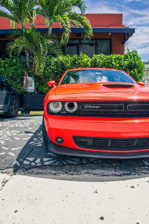 The front of a red Dodge Challenger