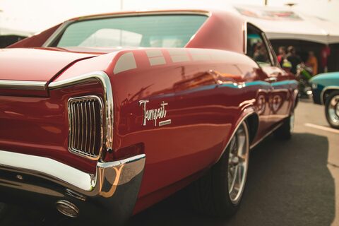 A red classic Pontiac Tempest up close