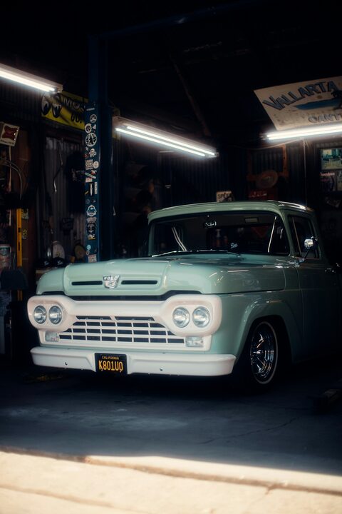 The front of a vintage Ford pickup truck