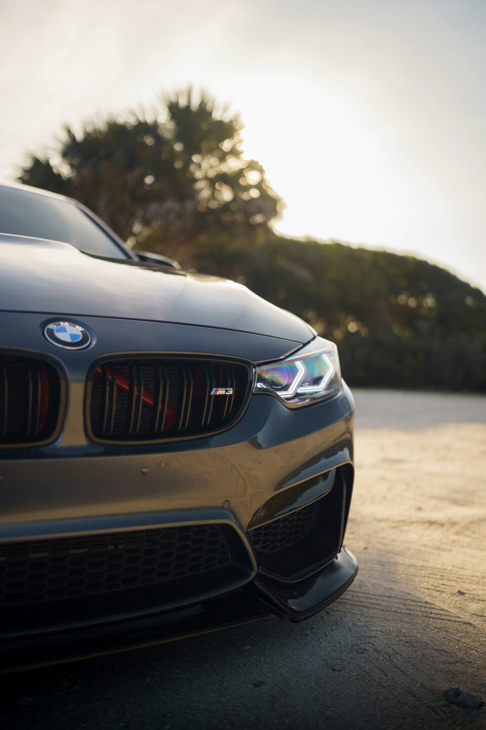The grille and headlight of a gray BMW