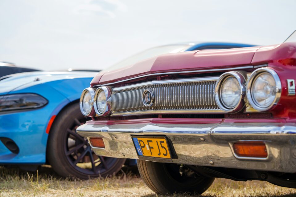 The chrome front of a red classic Chevrolet