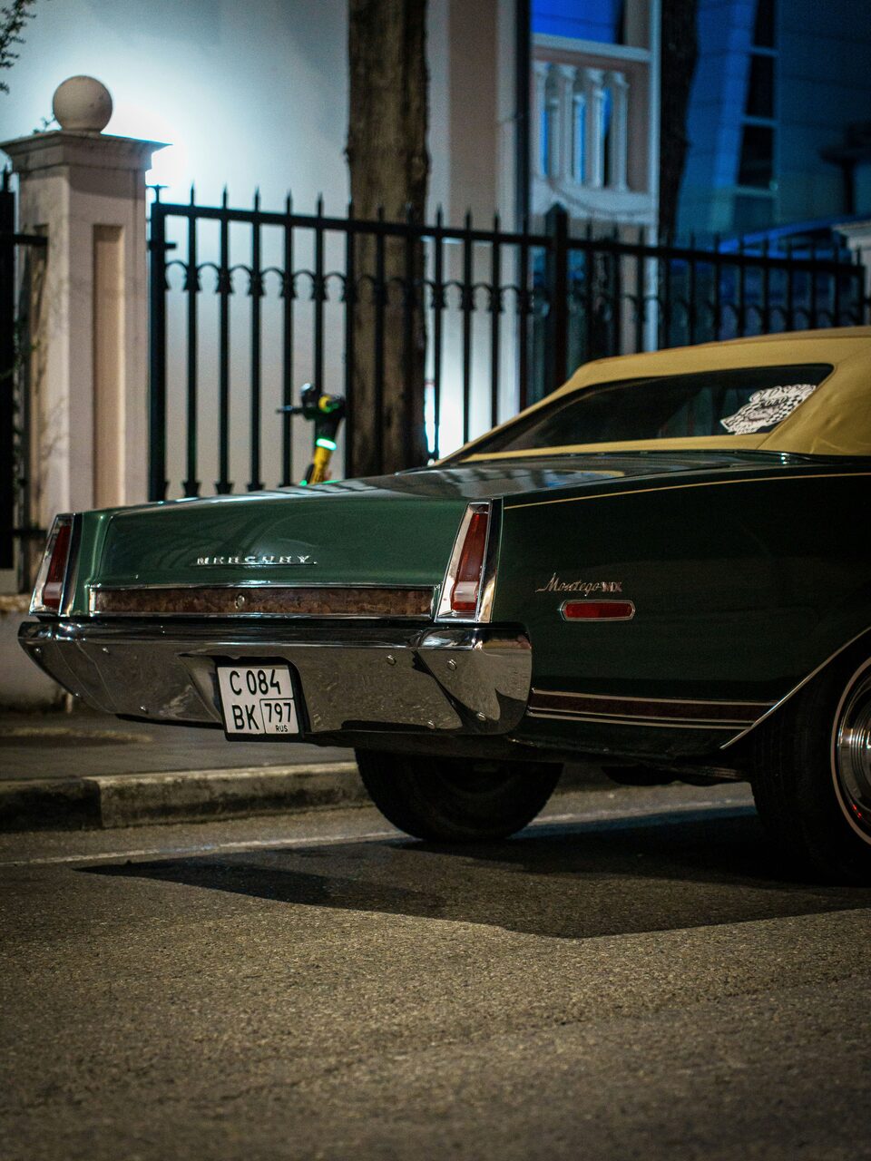 The rear of a dark green classic Mercury