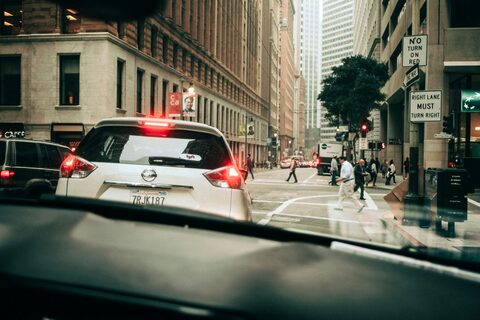 A white SUV on a city street